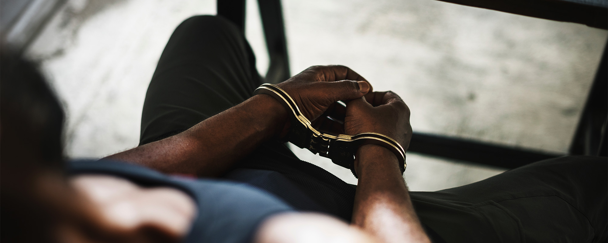 arrested man with handcuffs