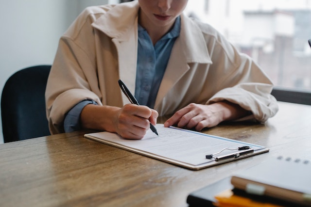 woman completing form